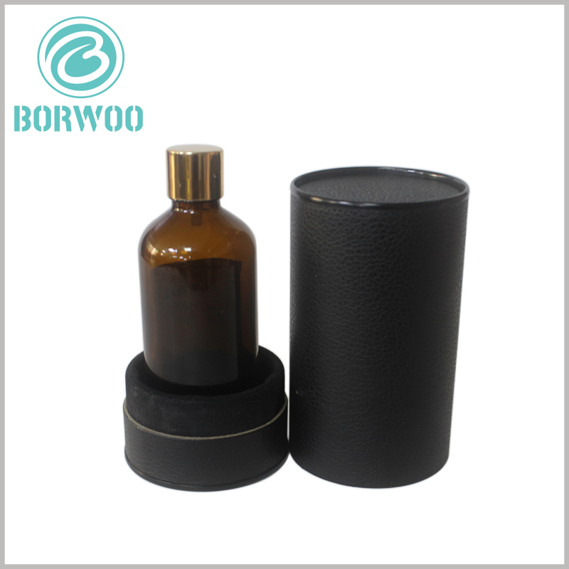 Black round cardboard tubes packaging for bottle boxes.a bigger lid on a small base with velour surface to absorb shocks.