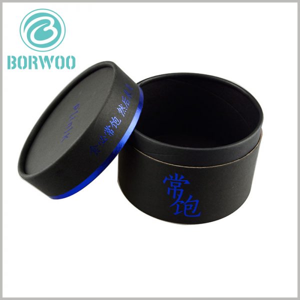 Black tube packaging boxes with paper lids. Customized paper tube hot stamping and printing, blue fonts and patterns can attract customers' attention and improve product recognition.