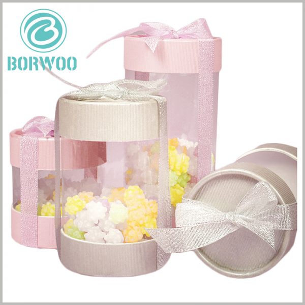 Clear plastic tube packaging for candy gift boxes.The pink packaging ribbon is used as a decoration for gift boxes, increasing the popularity of packaging.