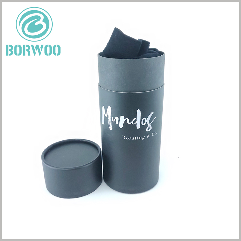 Black thick cardboard tube t shirt packaging boxes with lids.The diameter and height of the black cardboard round boxes are determined by the size of the shirt.