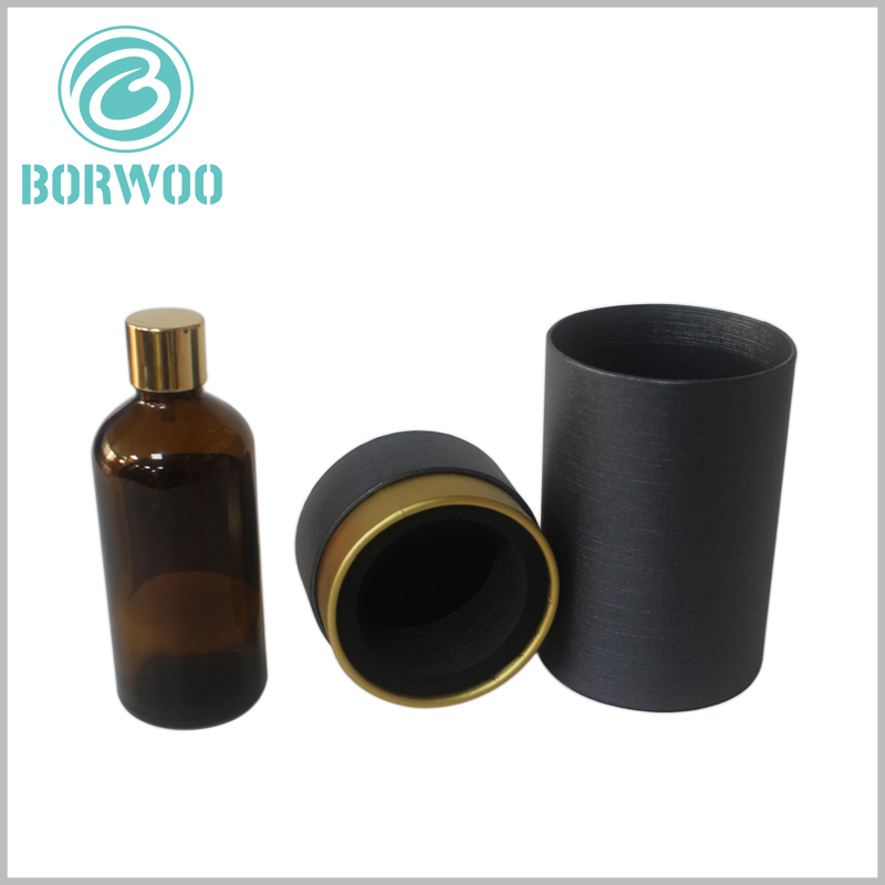 Custom Black round cardboard tubes packaging for glass bottle.The base of the paper tube is decorated with gold cardboard and EVA