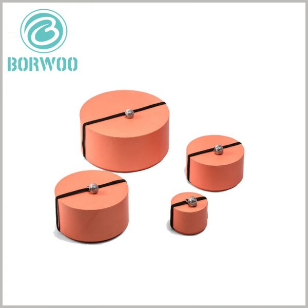 Orange paper tube packaging boxes wholesale. There is a black decorative rope on the top of the customized paper tube packaging, which can make the product packaging have a better aesthetic.