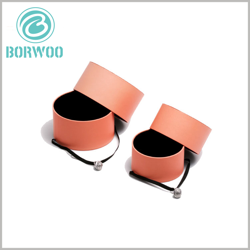 Orange small paper tube packaging for jewelry boxes. The diameter and height of the jewelry tube gift boxes can be customized and are related to the product characteristics.