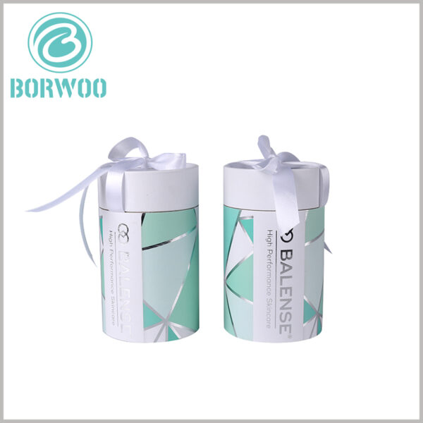 Paper tube gift packaging with bows for skin care boxes.The simplicity of design is realized by the clean style with LOGO