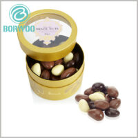 Small cardboard tube gift boxes for chocolates packaging.Exquisite round boxes are made of gold cardboard