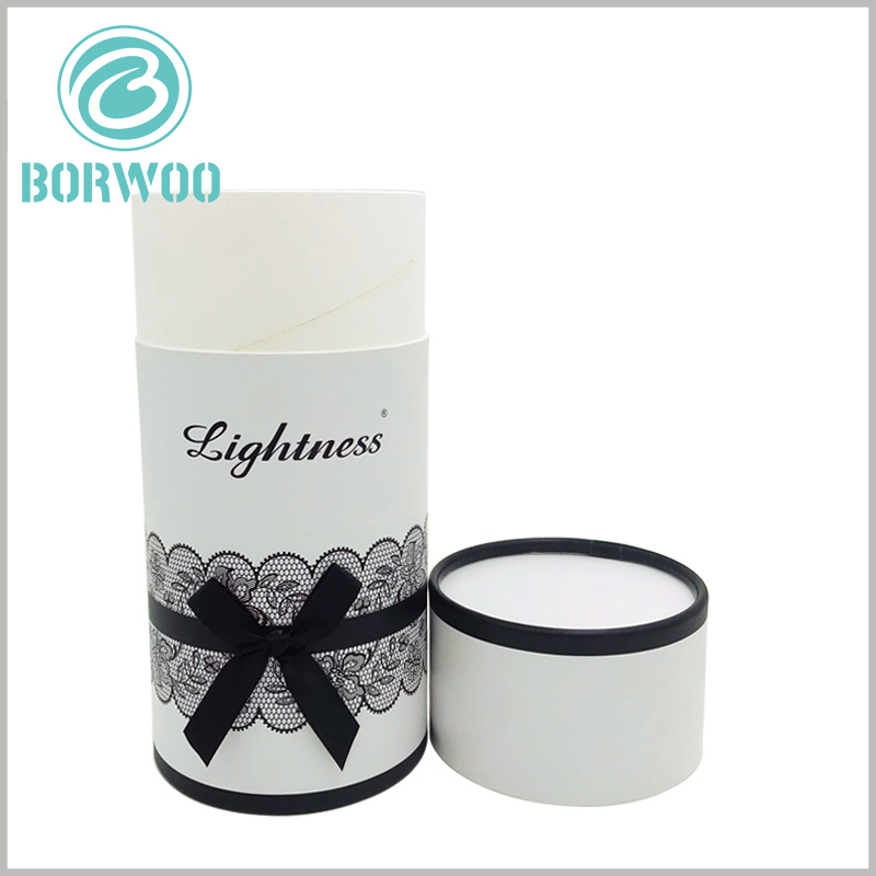 White cardboard tube gift packaging boxes with bows.On the edges, we applied a thick printing with high end ink to achieve an effect that make it look like a well smoothened one