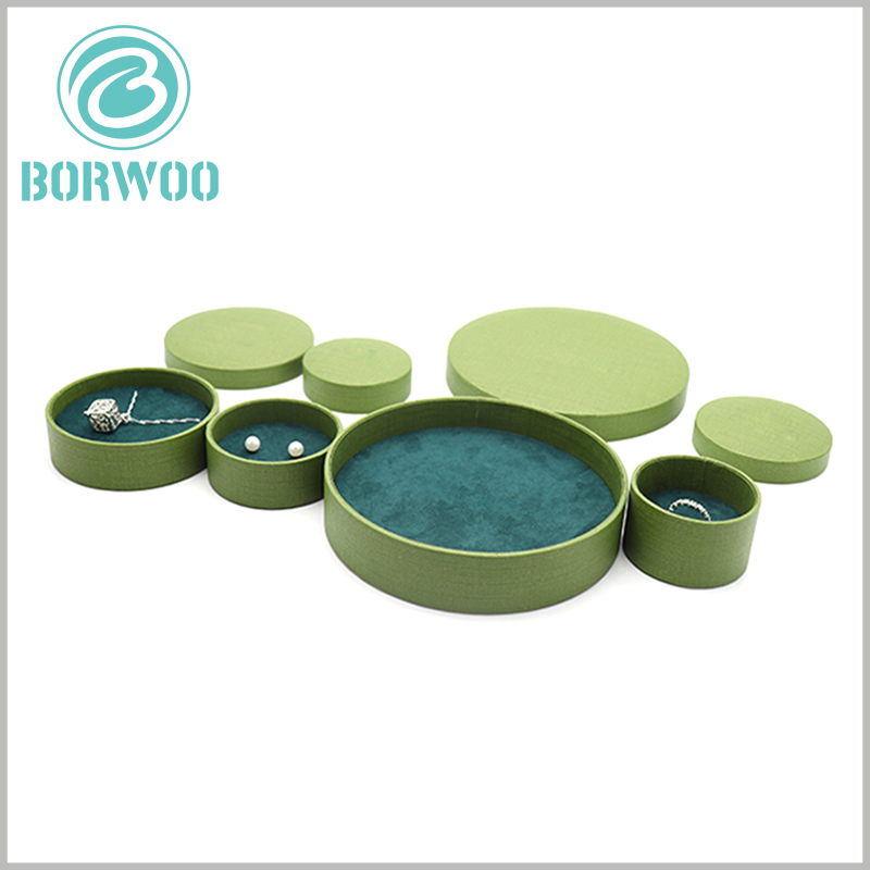creative round boxes with lids for jewelry packaging.The interior of the jewelry boxes has blue flocked cloth as an insert to protect the integrity of the product.