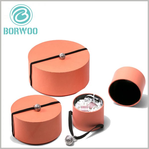 custom Orange paper tube gift packaging for jewelry. The custom tube packaging uses orange as the packaging background, and the warm color is good for improving the packaging visual experience.