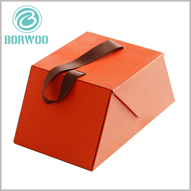 custom empty chocolate gift boxes with handle wholesale. The wide-brown silk cloth as a handle makes it easier to carry chocolate packaging and products.