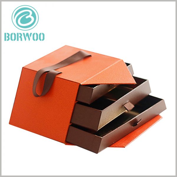custom holiday chocolate gift boxes with handle. The custom packaging has three layers of drawer inner boxes of different sizes, which will accommodate a larcustom holiday chocolate gift boxes with handle. The custom packaging has three layers of drawer inner boxes of different sizes, which will accommodate a larger amount of chocolateger amount of chocolate