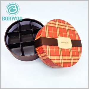 custom large round cardboard boxes for chocolates packaging.the tube is separated by black cardboard into small spaces for chocolates.