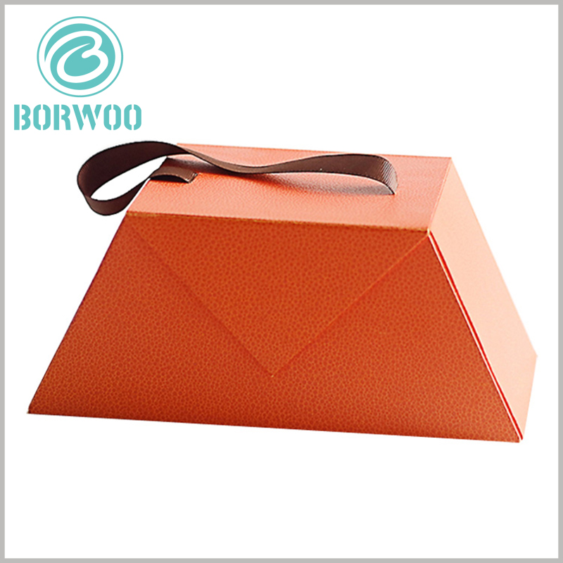 custom small chocolate gift boxes with handle wholesale. The orange packaging background belongs to a warm tone, which can give people a more warm visual sense.