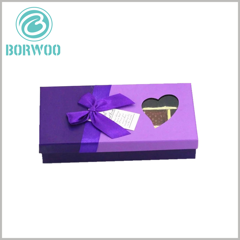 empty cardboard chocolate boxes with heart-shaped window wholesale.The purple packaging background design and purple gift bows are a good color choice and are popular with more women.